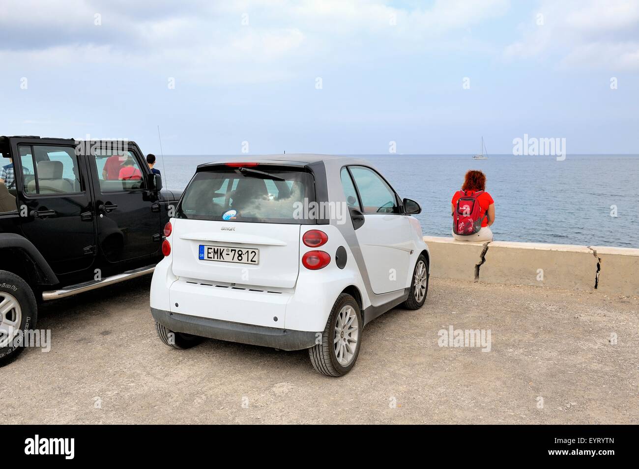 A holiday hire smart car parked up in vlychada Santorini Greece Stock Photo