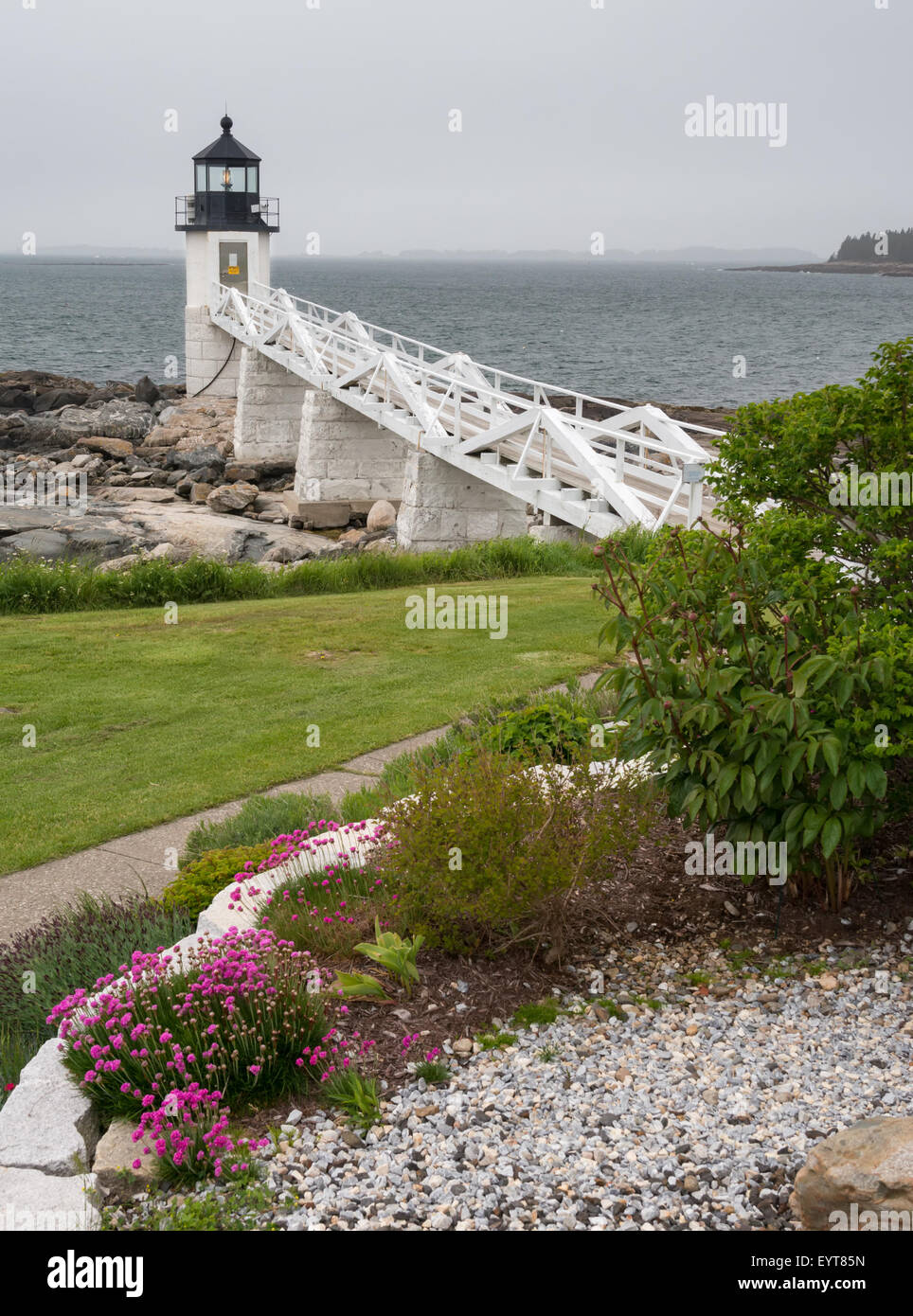 Garden and Marshall Point lighthouse, St. George, Maine, USA - Stock Image
