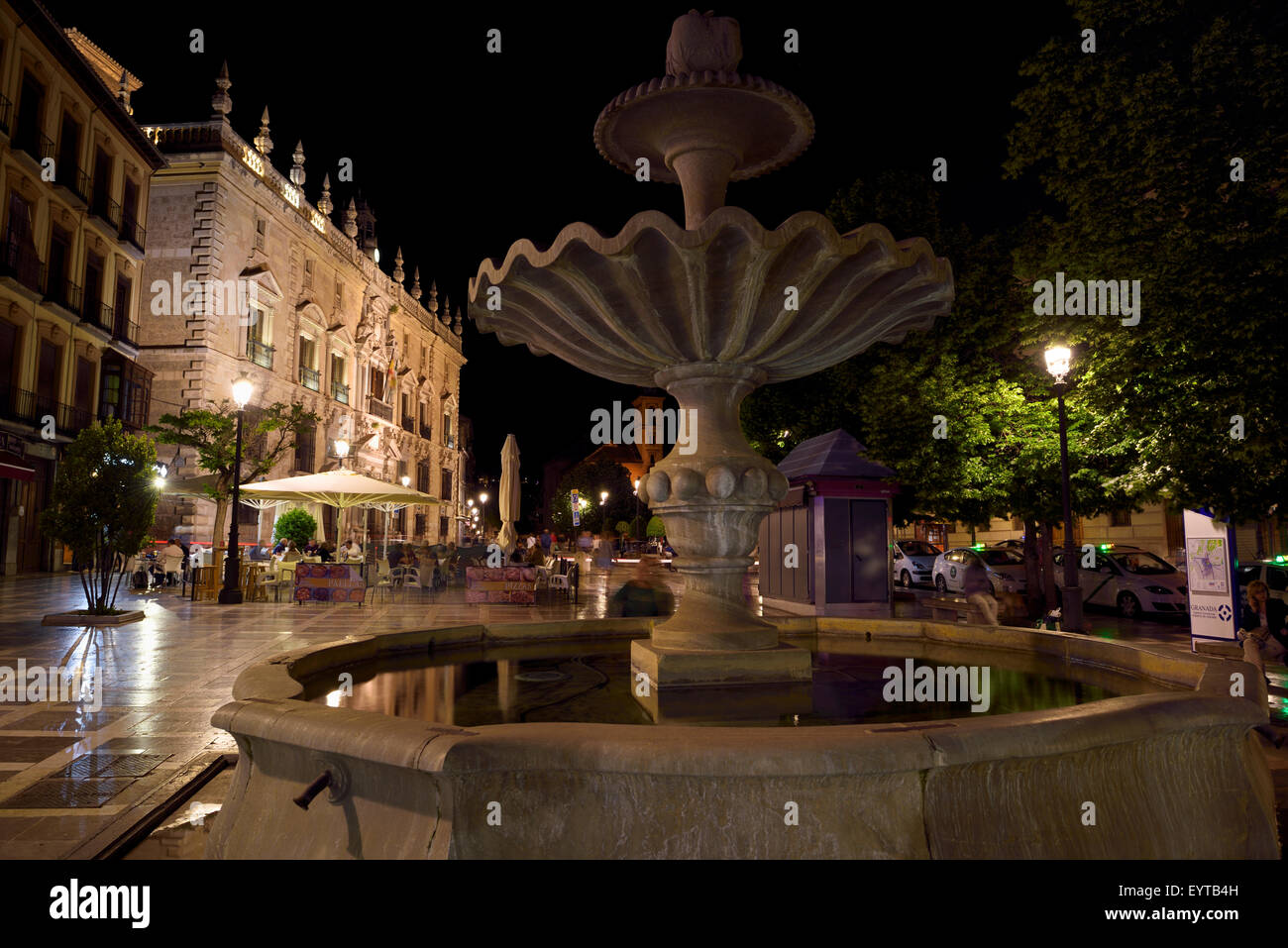 Fountain in Plaza Nueva at night with Royal Chancery of Granada and church of Santa Ana Stock Photo