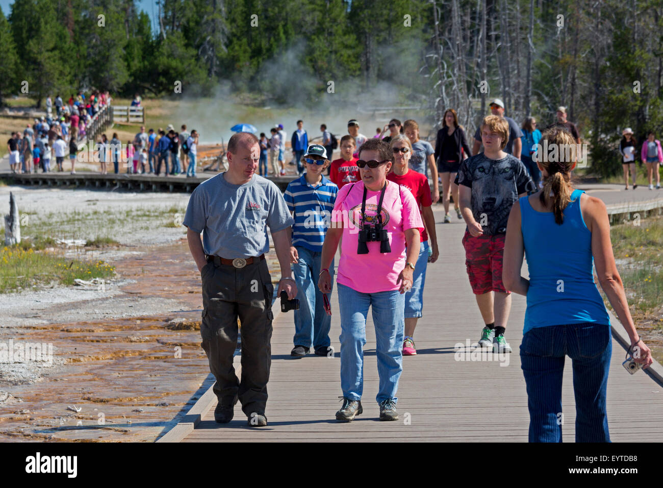 Yellowstone National Park, Wyoming - Tourists crowd the boardwalks in Yellowstone's Lower Geyser Basin. Stock Photo