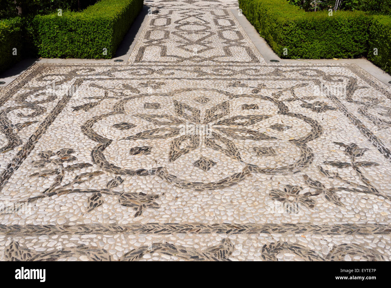 White stones from Darro river and black from Genil at San Francisco convent mosaic path Alhambra Granada Stock Photo
