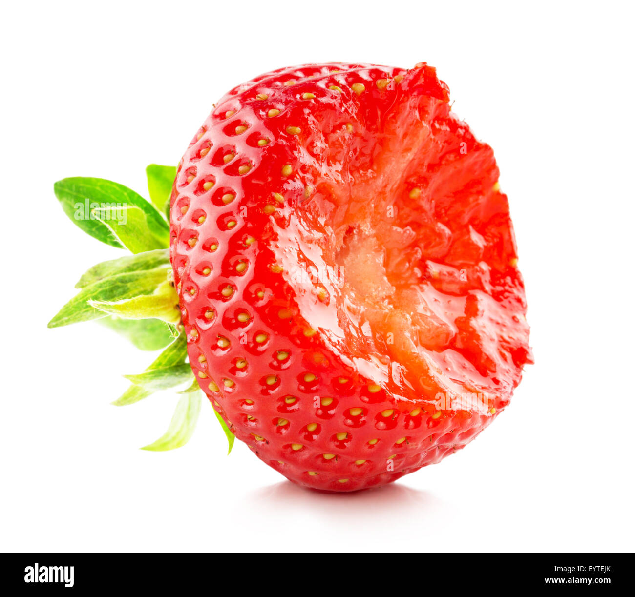 bitten strawberry on the white background. Stock Photo