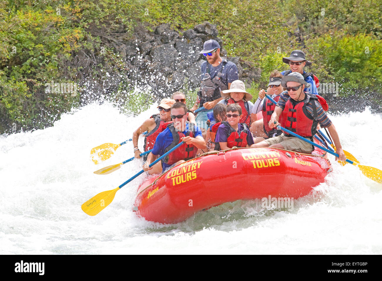 Whitewater rafters during the summer onBig Eddy Falls on the Deschutes River near Bend, Oregon Stock Photo