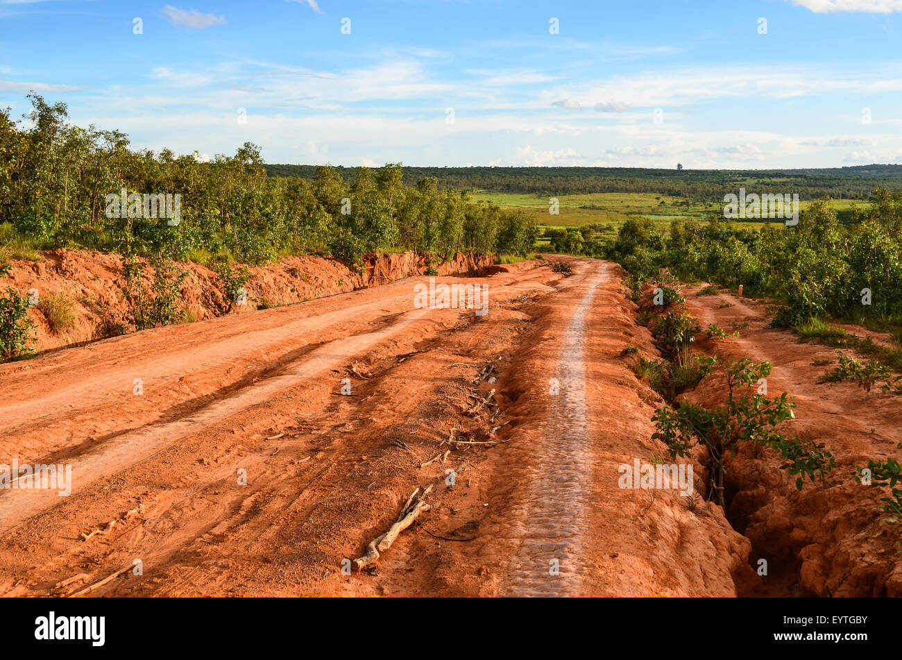 Dirt road of red mud / laterite in Angola near Chicuma Stock Photo