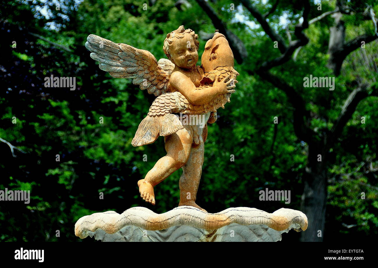 Newport, Rhode Island Cupid statue holding a dolphin in the gardens at