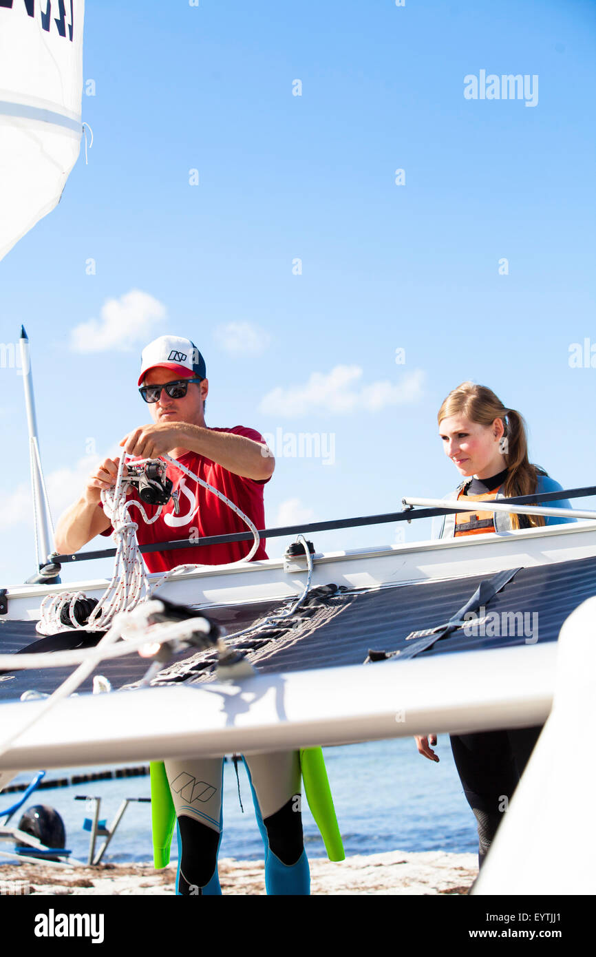 Sail lessons on catamaran, preparations for sailing Stock Photo Alamy
