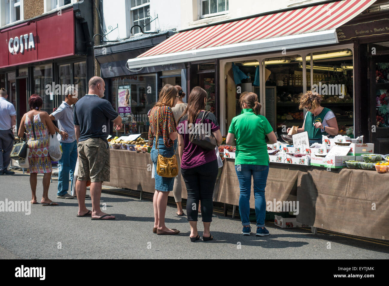 Busy Fruit and Vegetable Stall High Street Hythe Kent UK Stock Photo