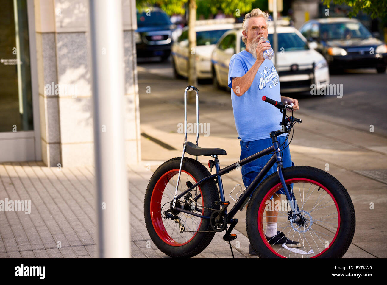 Man with a fat tire bike at the CMA Music Festival in Nashville Tennessee Stock Photo