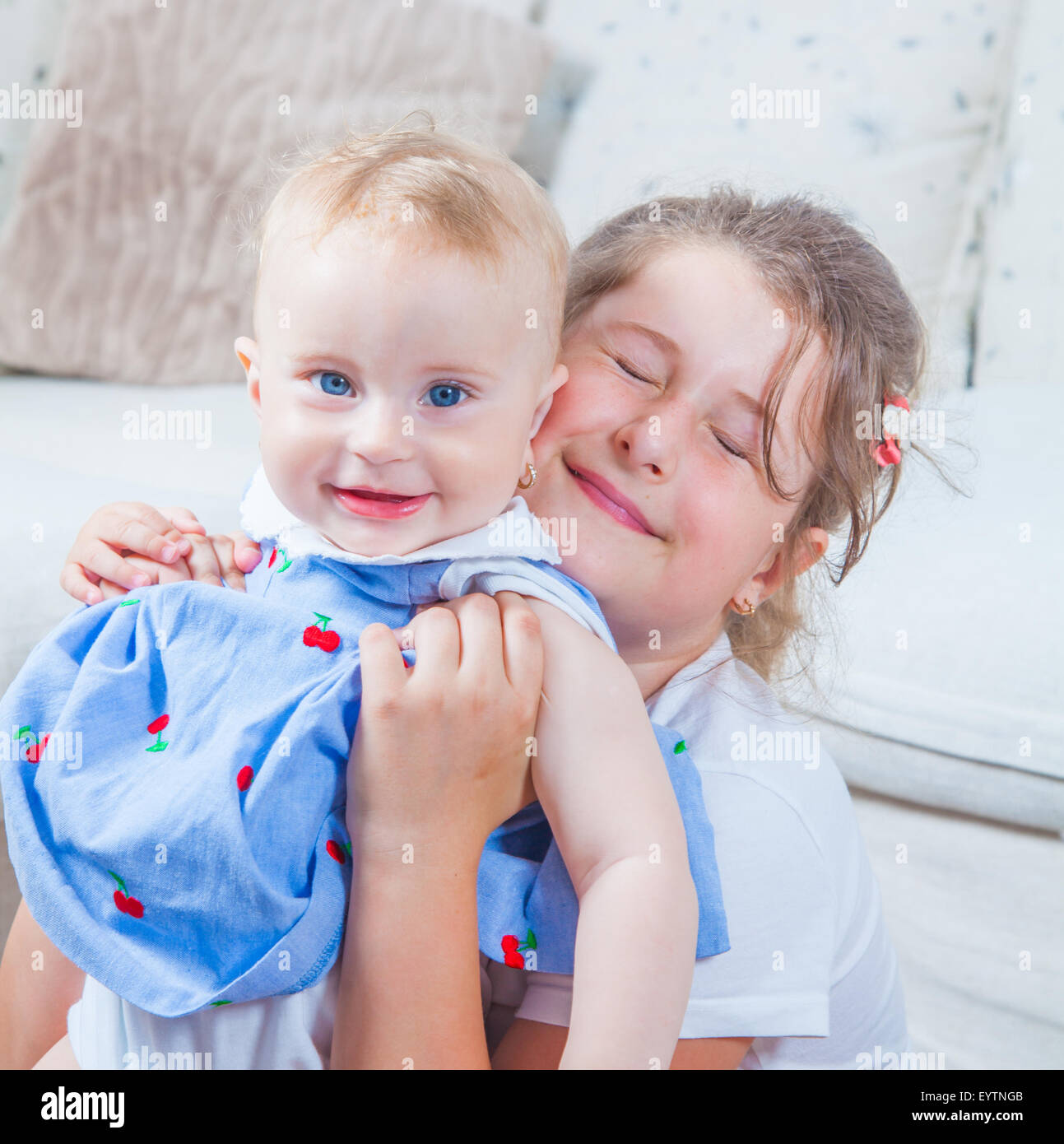 big-sister-holding-her-1-year-old-baby-sister-stock-photo-alamy