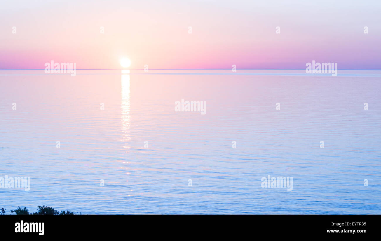 shape reflection sea. Sun reflection on the sea in a normal and foregone sunset Stock Photo