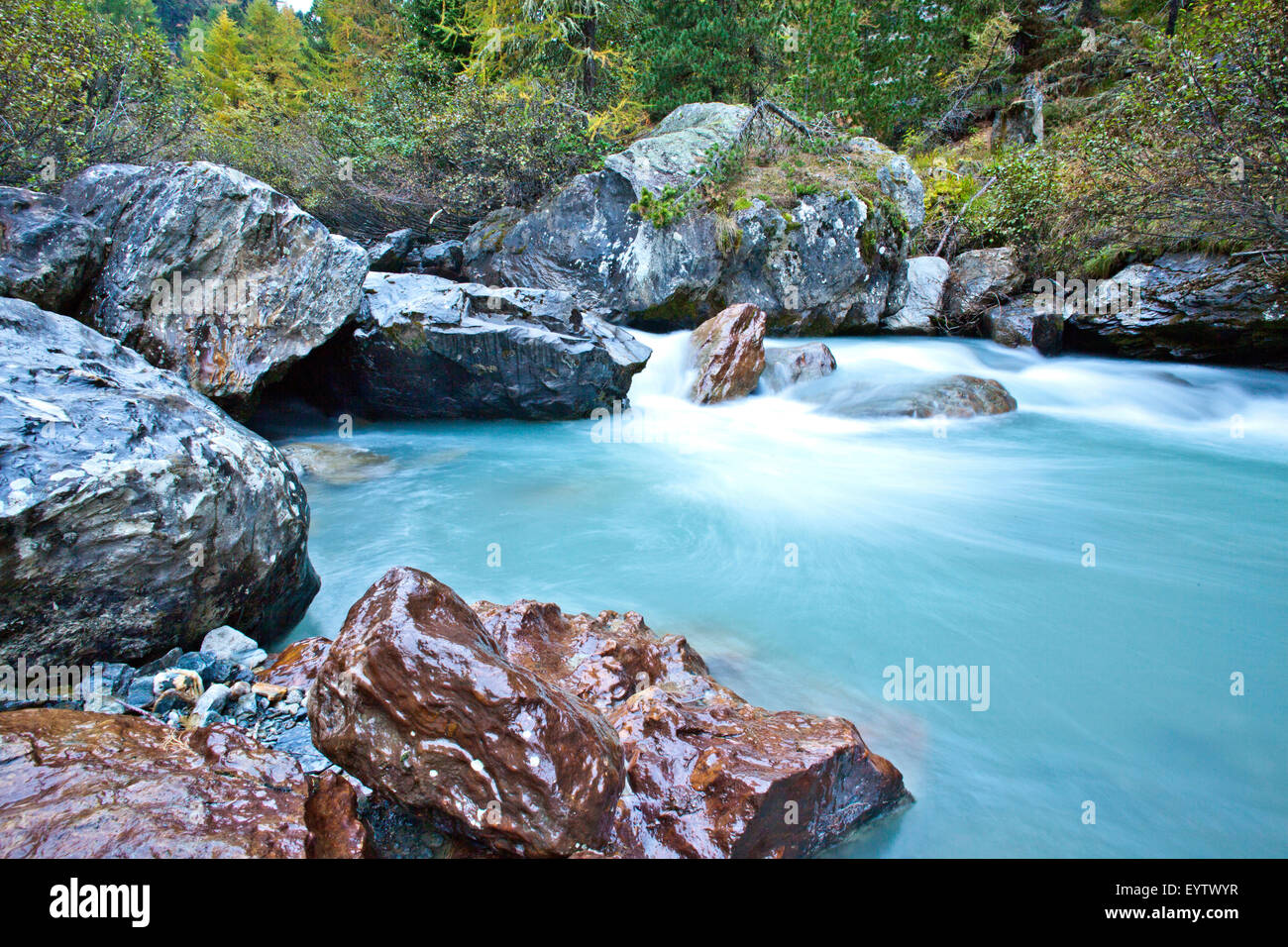 Boulders in a mountain stream Stock Photo