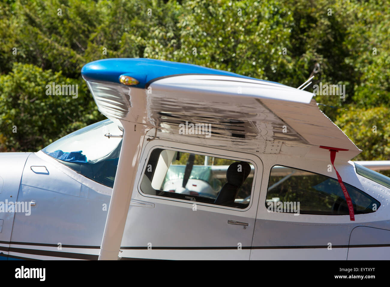 Small white airplane parked in the small airport of Canaima National Park in venezuela. Stock Photo