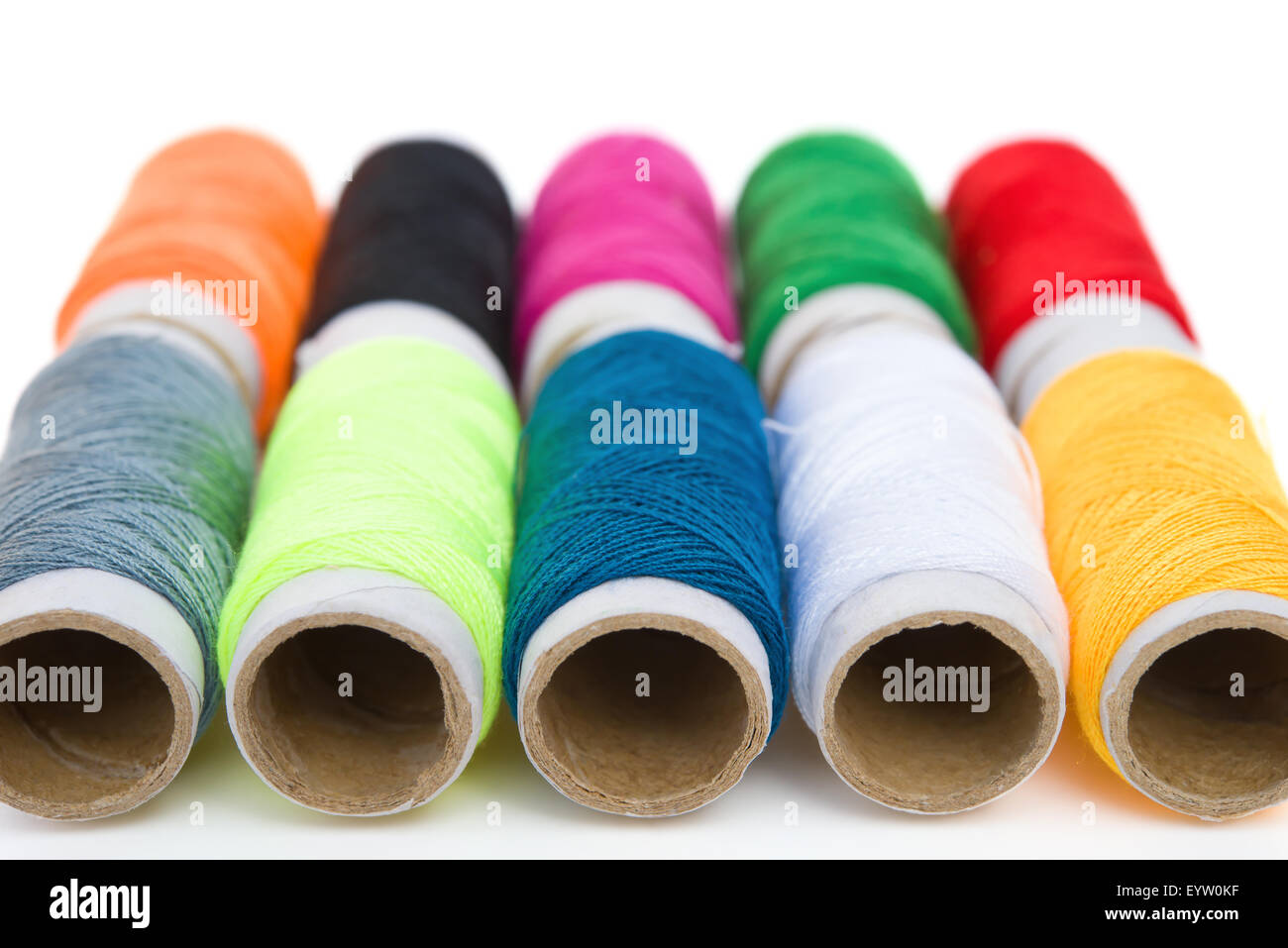 Several yarn bobbins of different colors and sizes Stock Photo - Alamy