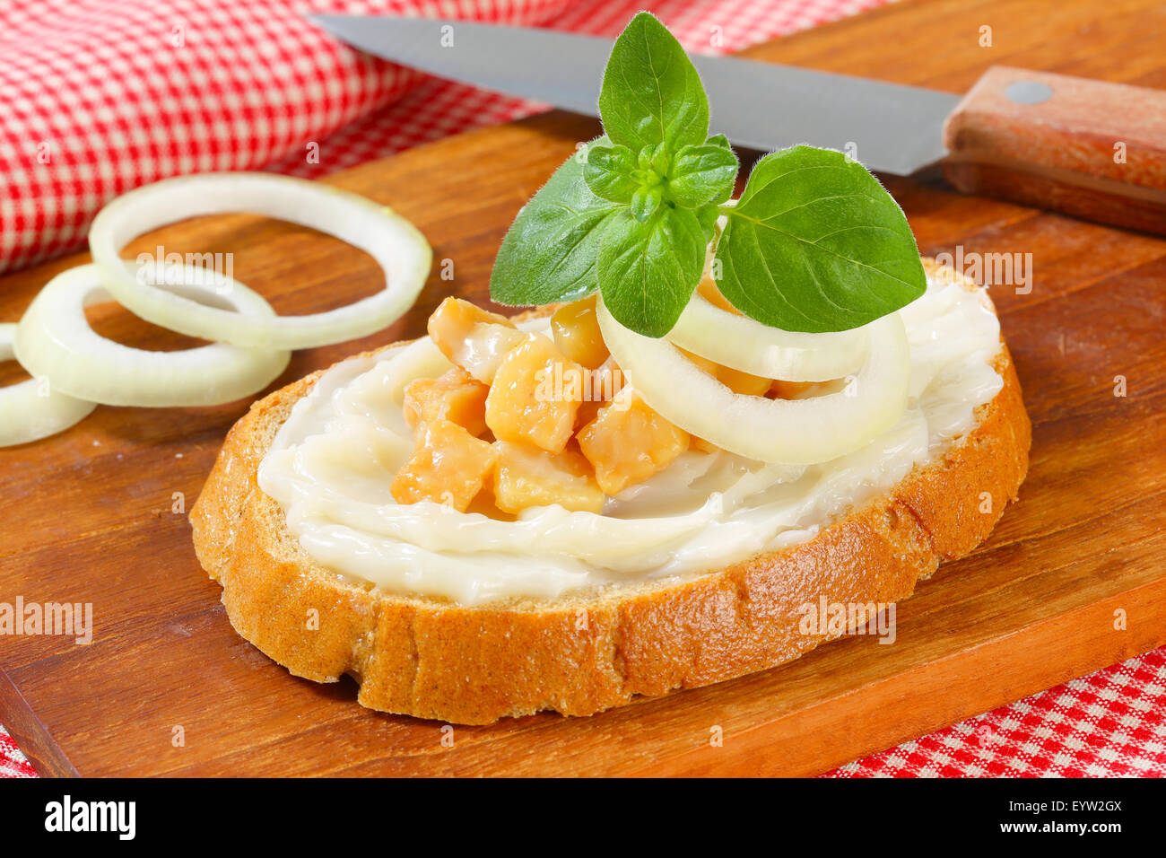 Slice of bread spread with lard and greaves Stock Photo Alamy
