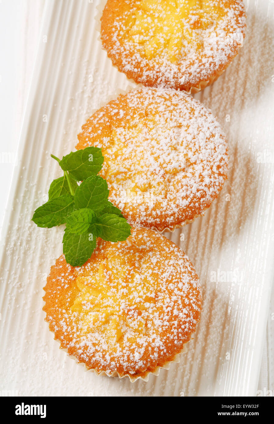 Custard filled muffins on long plate Stock Photo Alamy