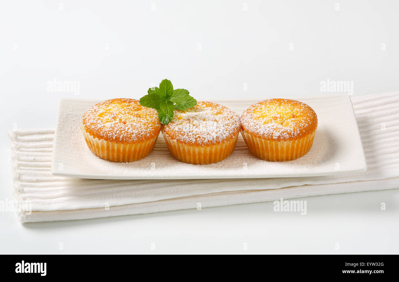 Custard filled muffins on long plate Stock Photo Alamy