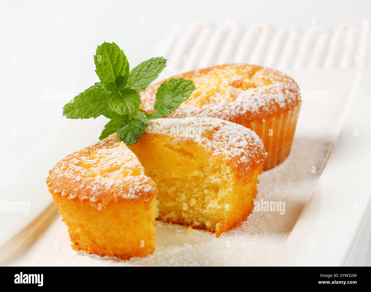 Custard filled muffins on plate Stock Photo Alamy