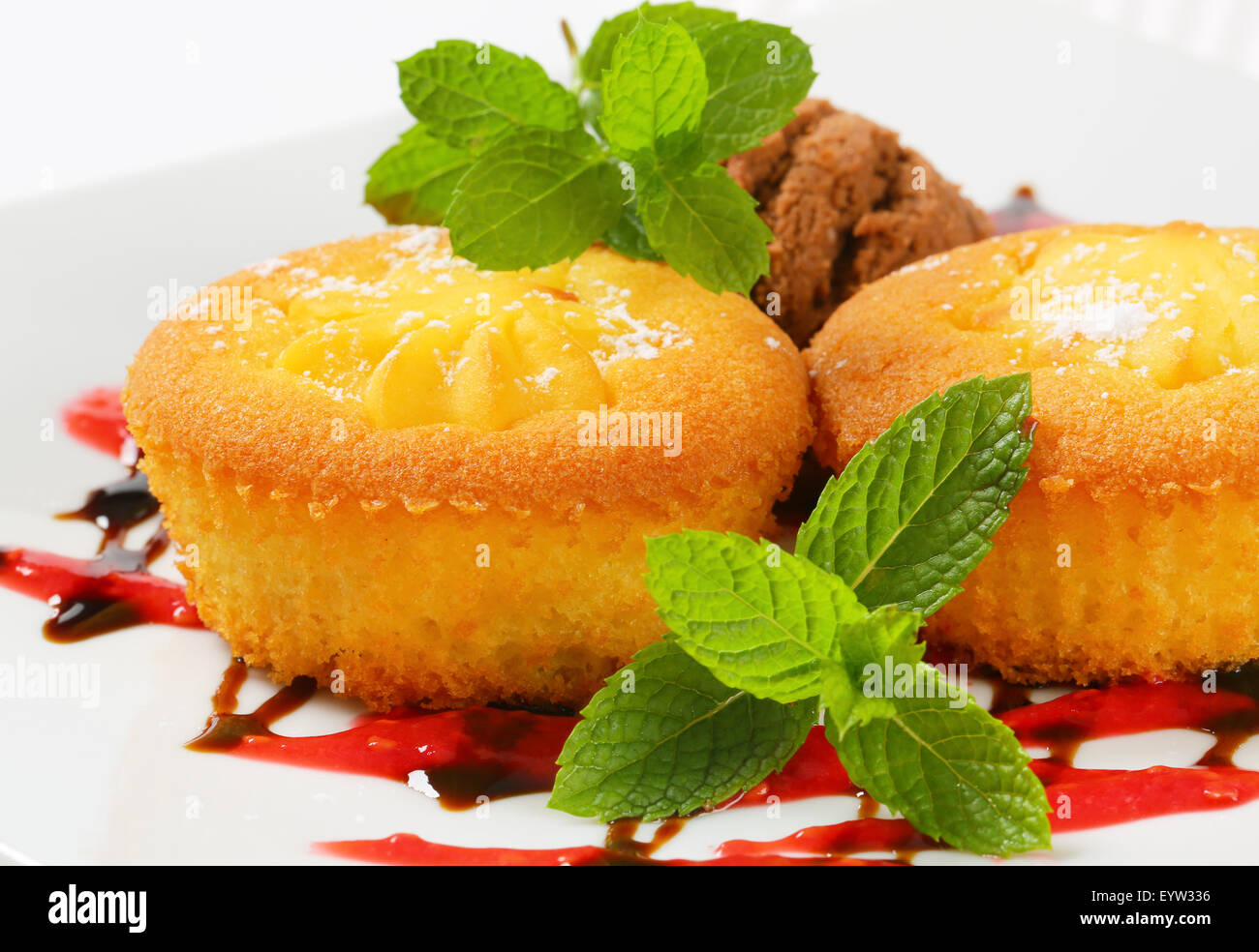 Pudding filled cupcakes and scoop of ice cream Stock Photo Alamy