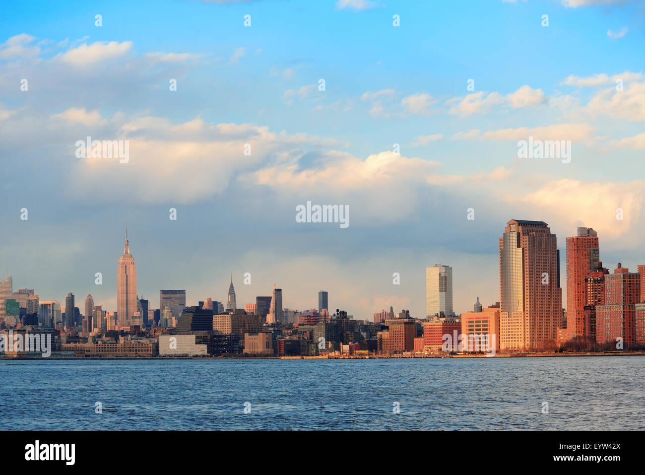 Downtown Manhattan skyline at sunset over Hudson River in New York City ...