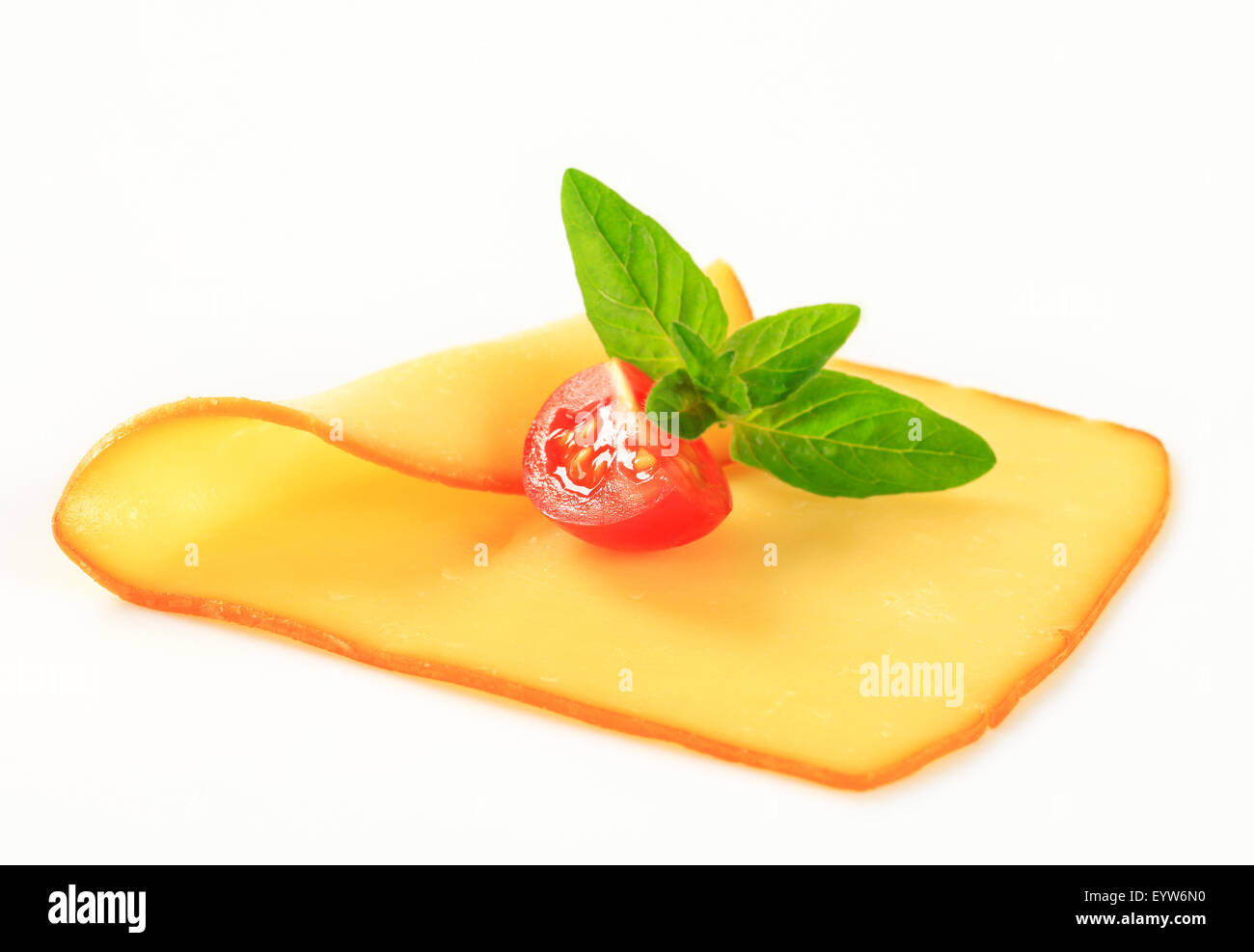 Thin slice of smoked yellow cheese Stock Photo Alamy