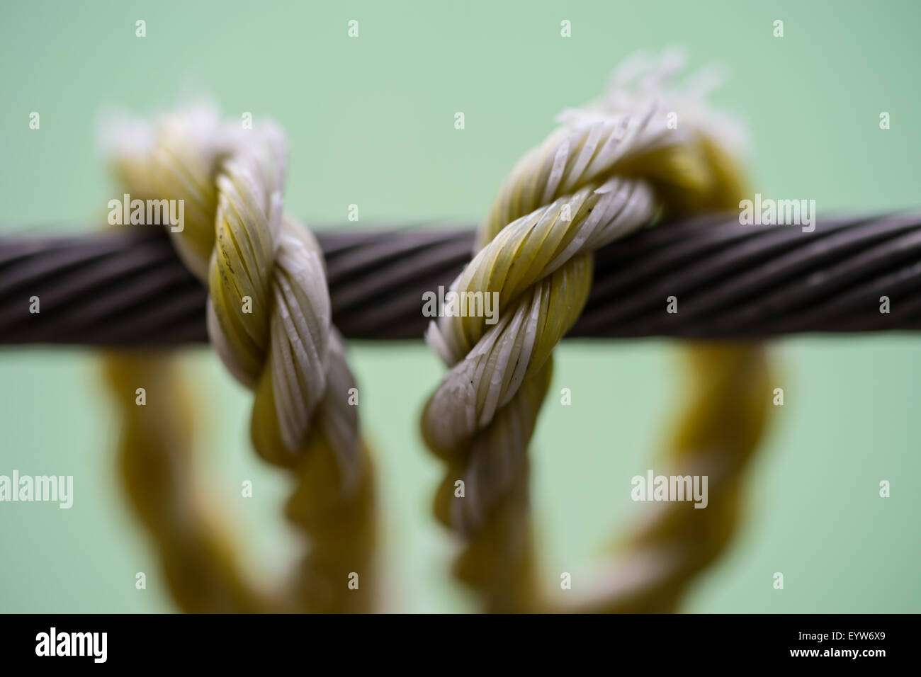 A washing line tied round a cable on a balcony Stock Photo - Alamy