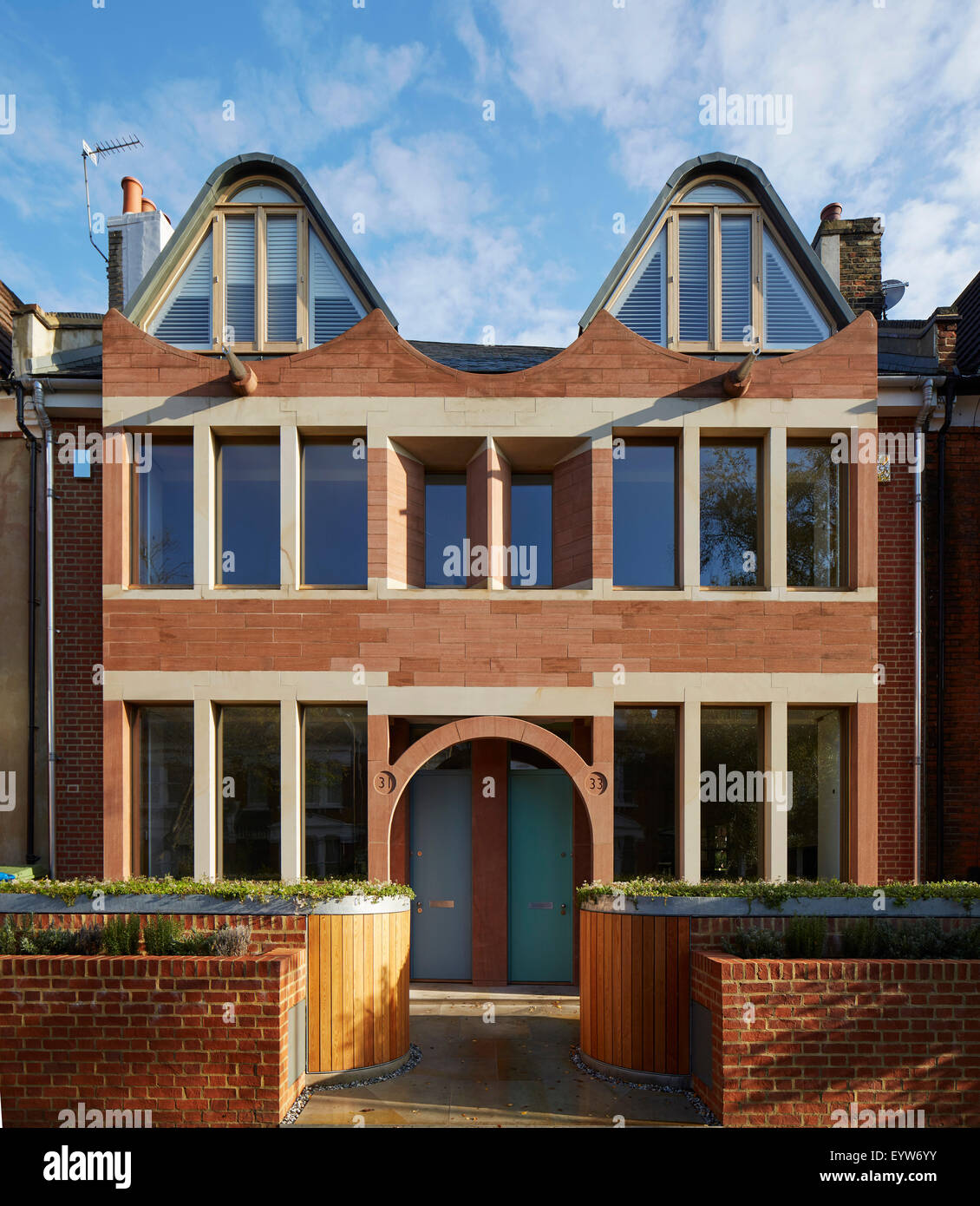 Symmetrical front elevation. London Brownstones, London, United Kingdom. Architect: Knox Bhavan Architects LLP, 2014. Stock Photo