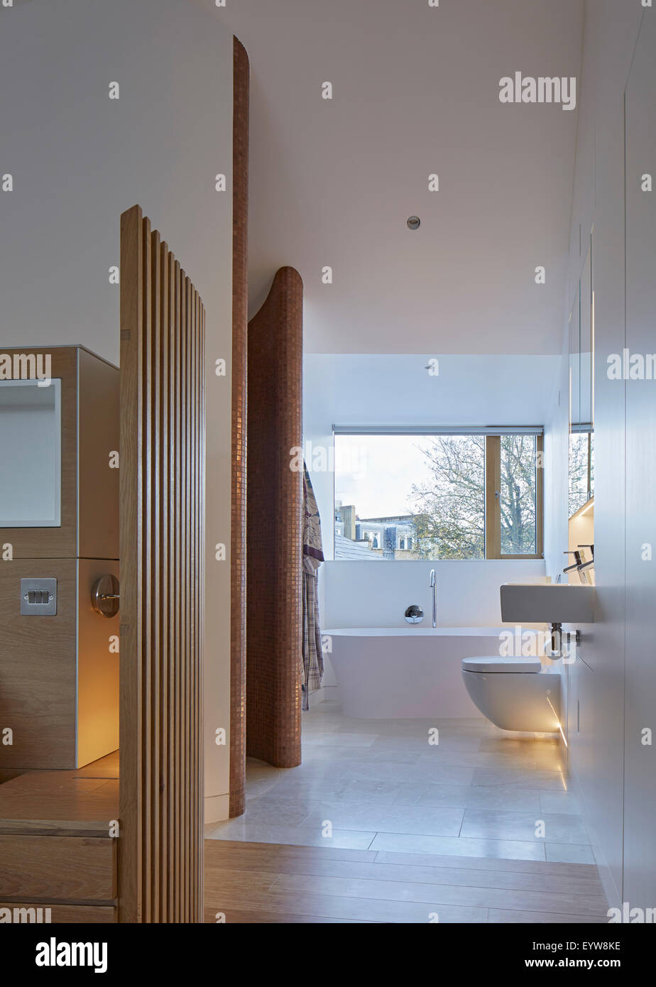 Bathroom with large rectangular window. London Brownstones, London, United Kingdom. Architect: Knox Bhavan Architects LLP, 2014. Stock Photo