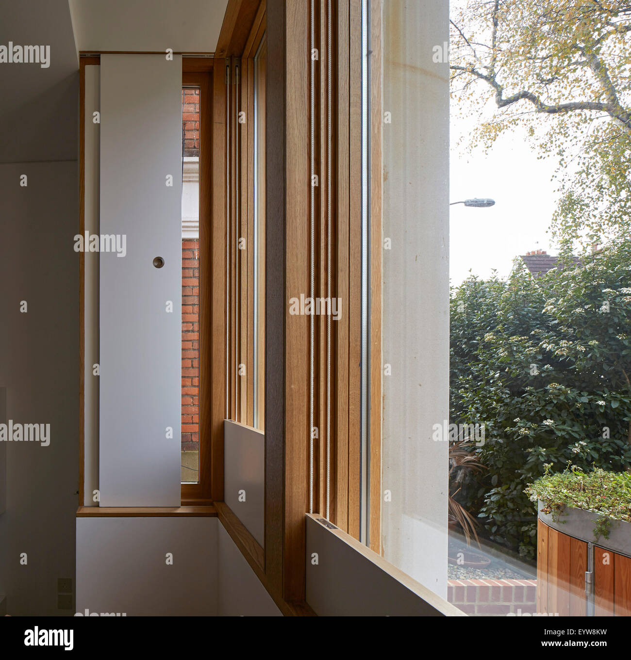 Integrated sliding shutters. London Brownstones, London, United Kingdom. Architect: Knox Bhavan Architects LLP, 2014. Stock Photo