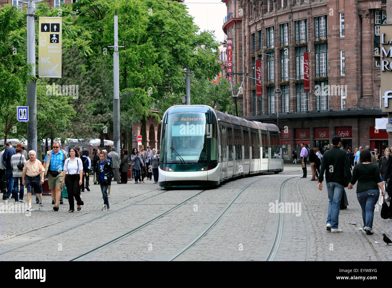 Modern tram in the pedestrianised Rue des Francs-Bourgeois in the centre of Strasbourg, France. Left: the Place Kleber. Stock Photo