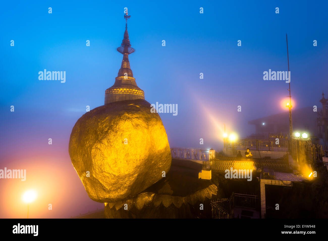 Golden Rock at dusk with Kyaiktiyo Pagoda, Kyaikto, Thaton District, Mon State, Myanmar, Myanmar Stock Photo