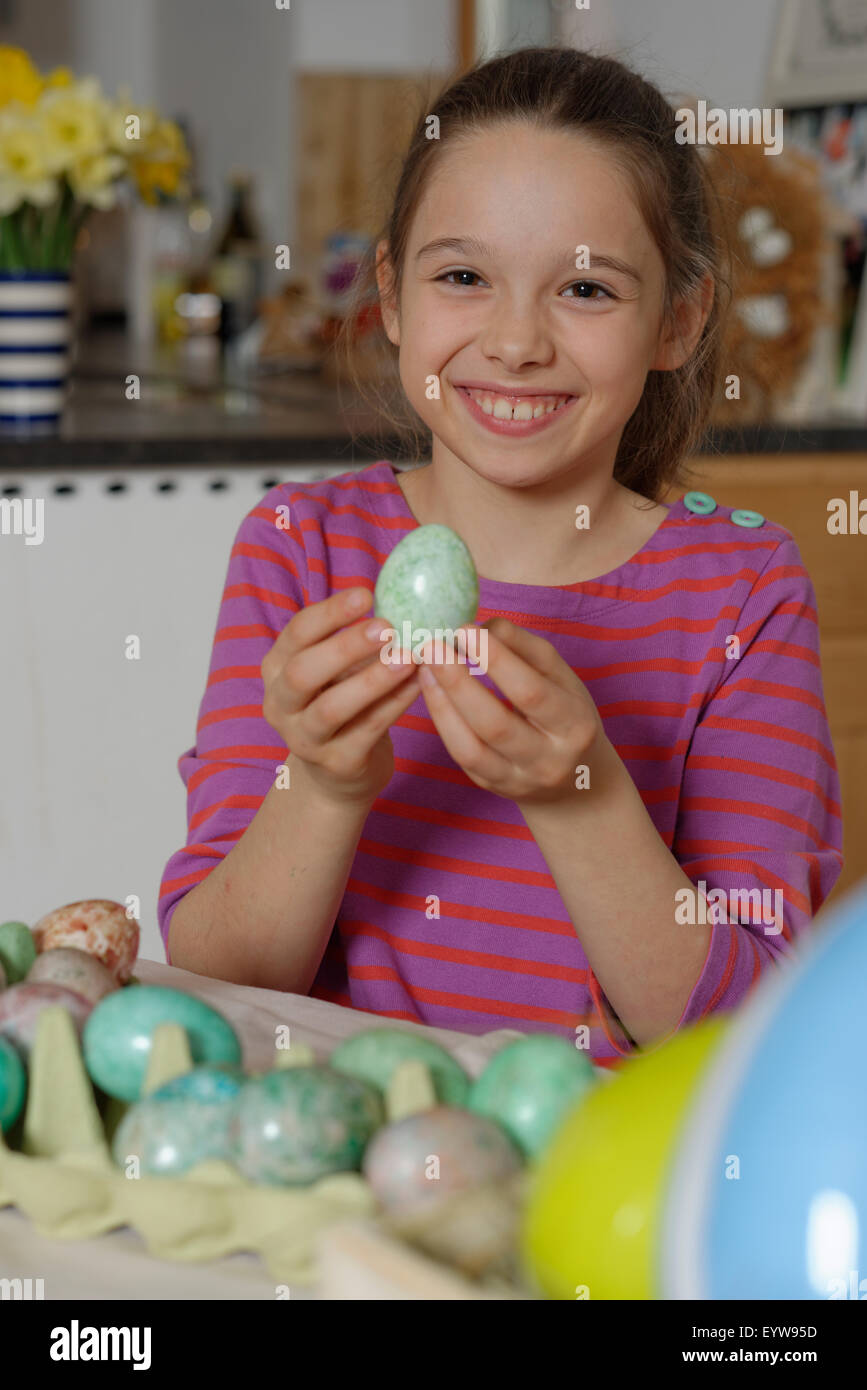 Girl colouring Easter eggs for the Easter basket, coloured eggs, Easter, Upper Bavaria, Bavaria, Germany Stock Photo