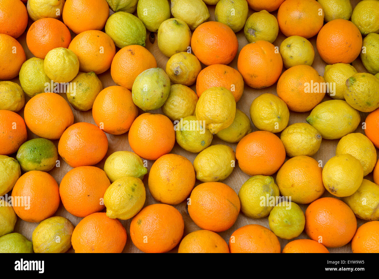 a bunch of lemons and oranges in a wooden box Stock Photo - Alamy