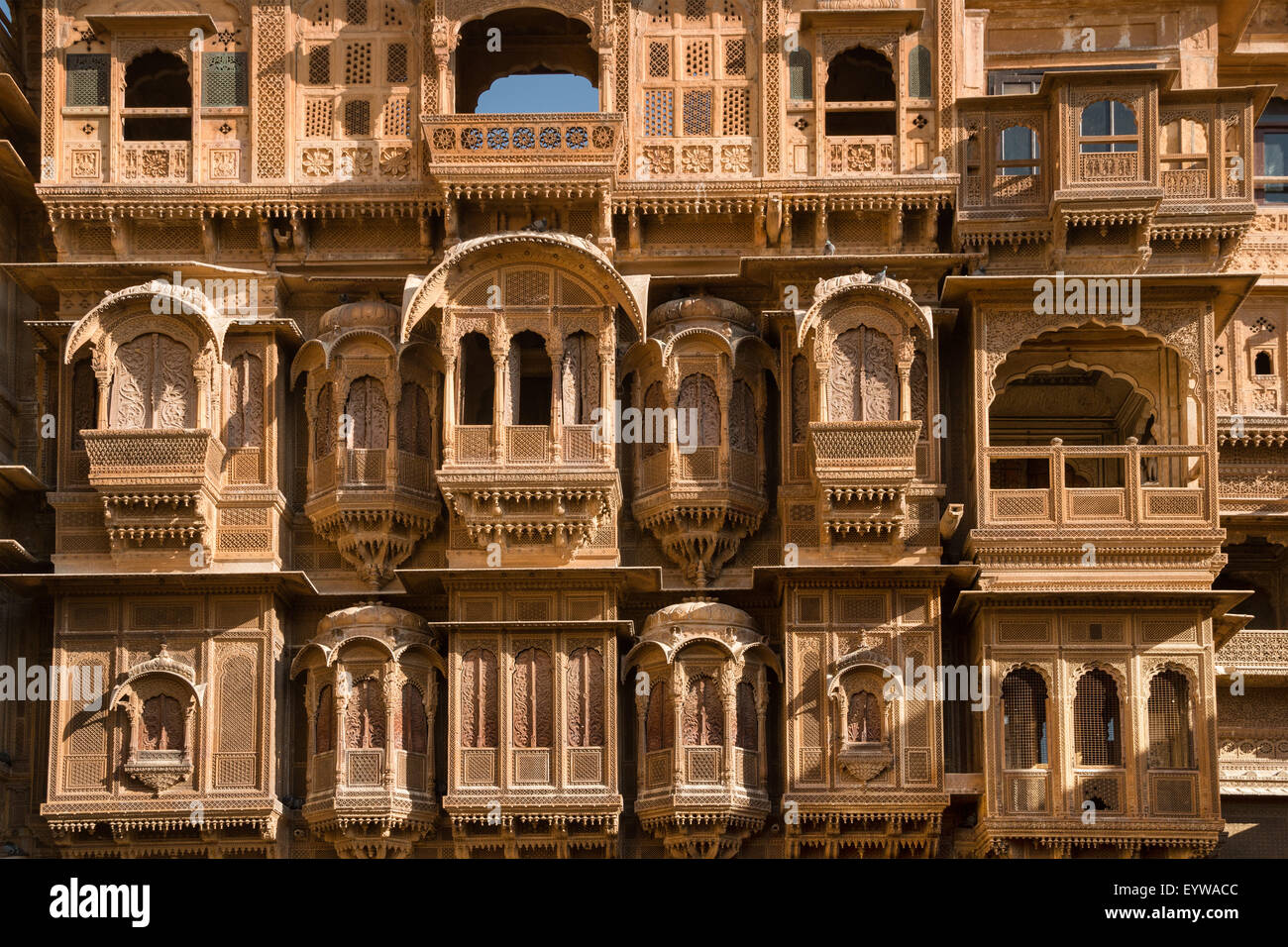 Windows and balconies, delicately decorated facade of Patwon Ki Haveli or Patwa ki Haveli, Jaisalmer, Rajasthan, India Stock Photo