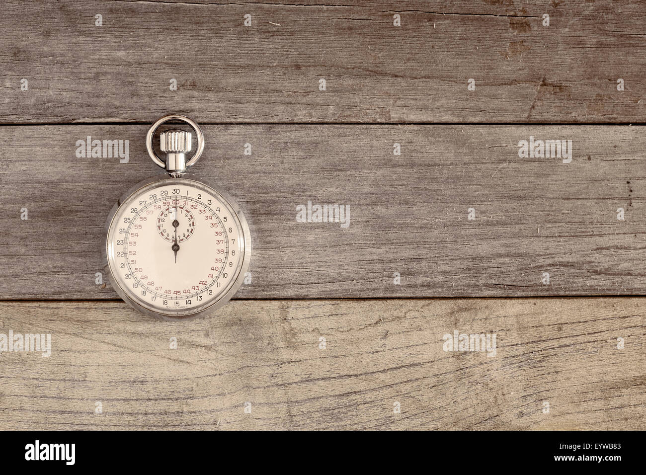 An old and vintage stopwatch over a wooden surface Stock Photo - Alamy