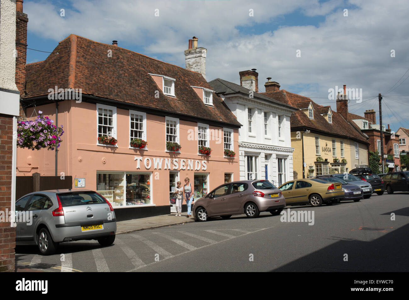 Pastel colored buildings line the High Street of Manningtree in the district of Tendering within the county of Essex Stock Photo