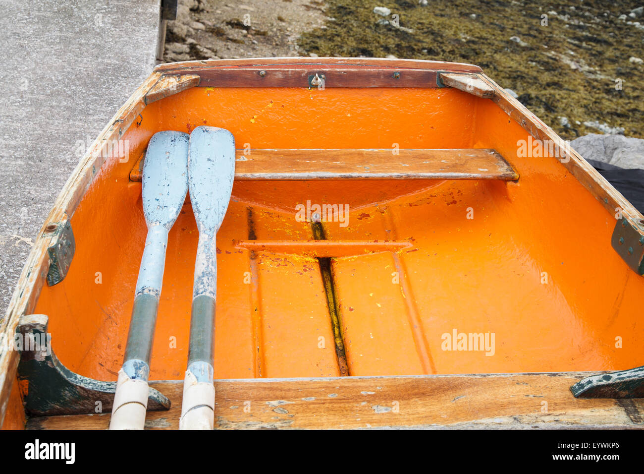 Orange fishing boat in Ullapool, Scotland Stock Photo