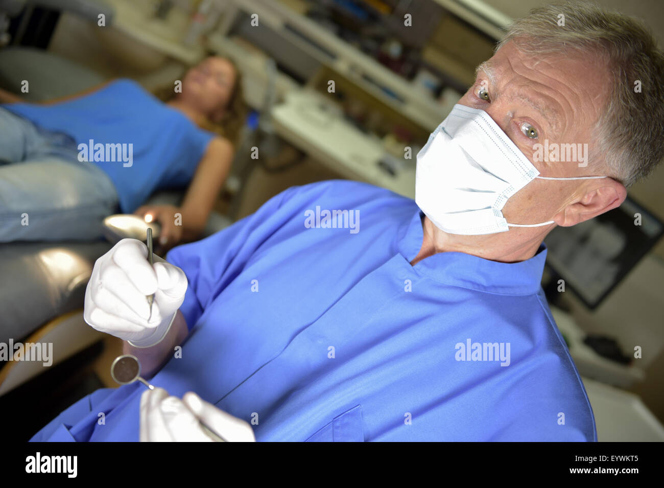 Dentist doing dental examination Stock Photo - Alamy