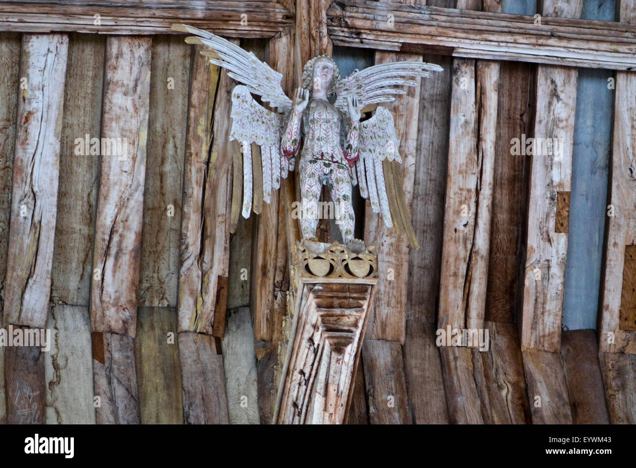 carved wooden angel on roof beam Stock Photo