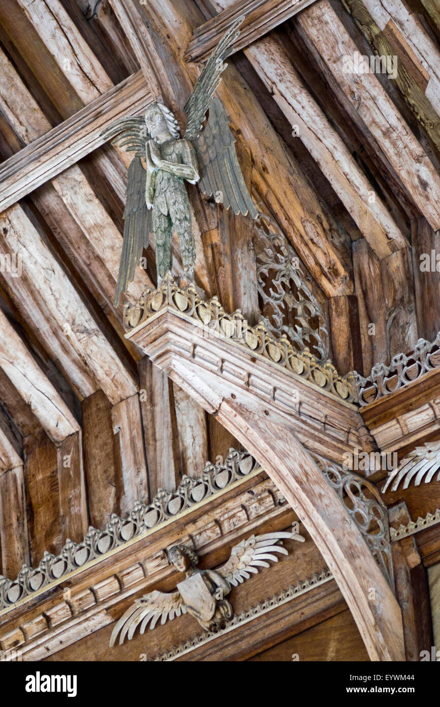 carved wooden angel on roof beam Stock Photo