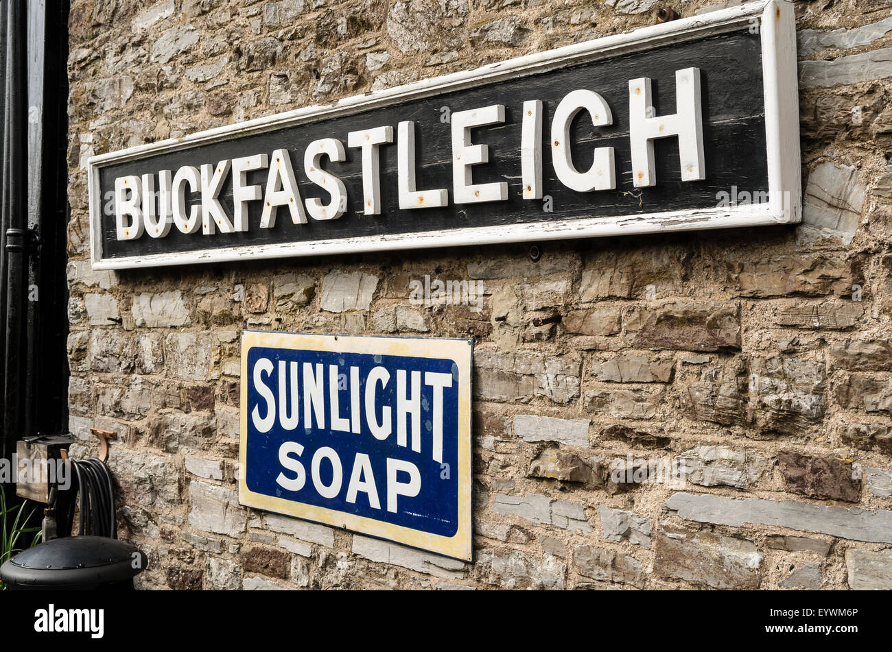 BUCKFASTLEIGH railway station sign and advertising in UK Stock Photo