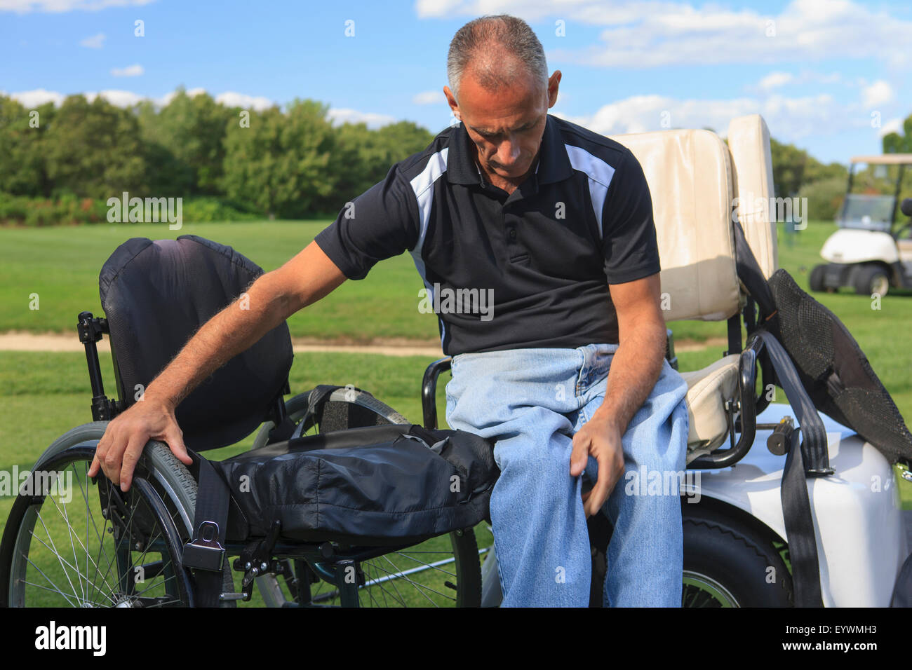Pushing Cart Injuries Man with a spinal cord injury in an adaptive golf cart getting into his ...