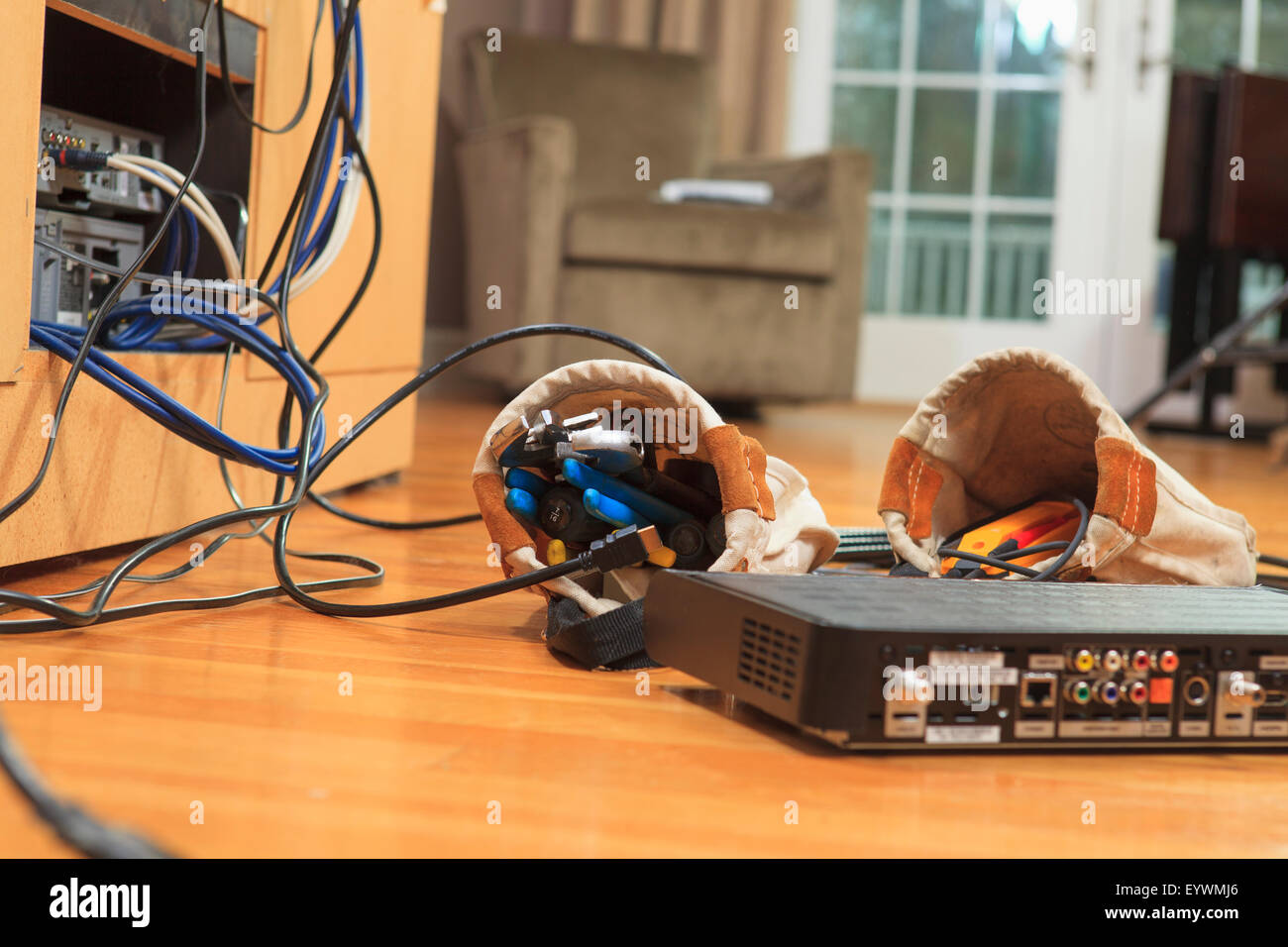 Cable box and installation tool bags on floor of home Stock Photo Alamy