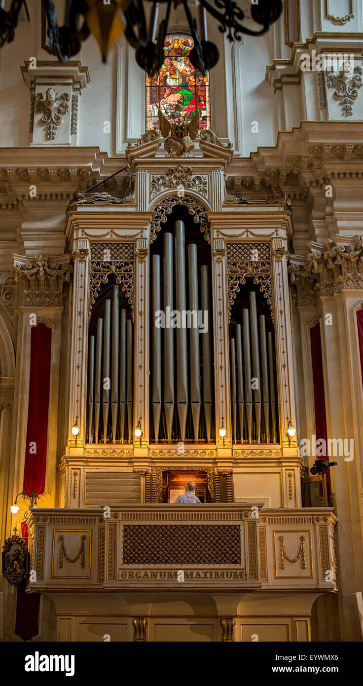 Organist playing the pipe organ in the celebration of the christian
