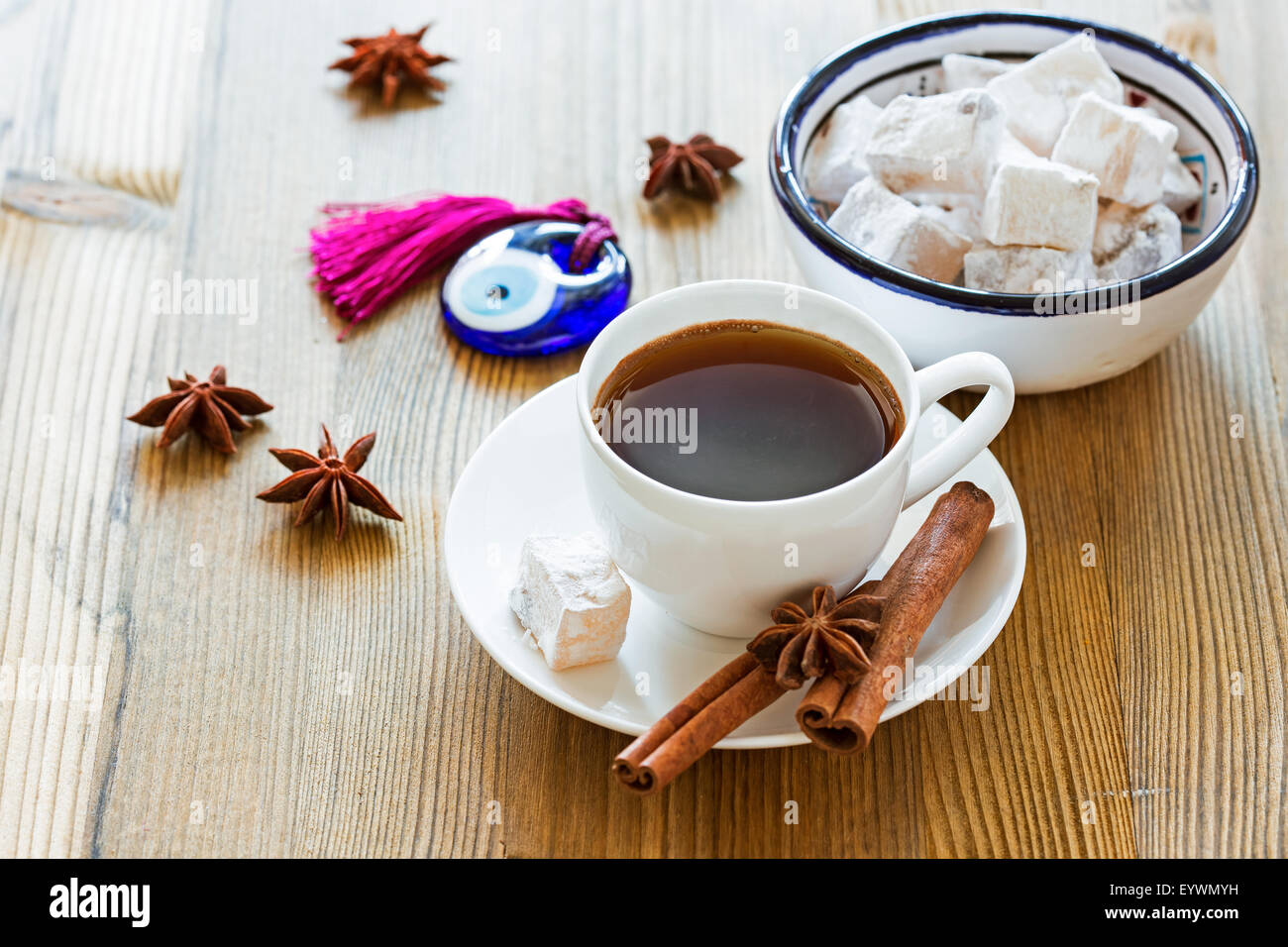 Cup of coffee with spices and Turkish sweets and glass amulet Evil Eye Stock Photo