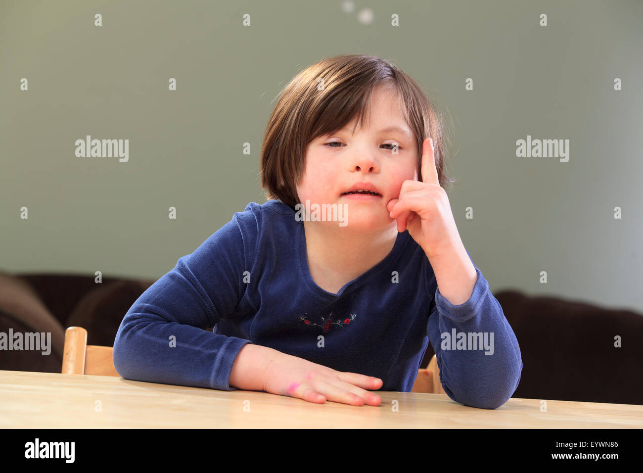 Little girl with Down Syndrome talking Stock Photo