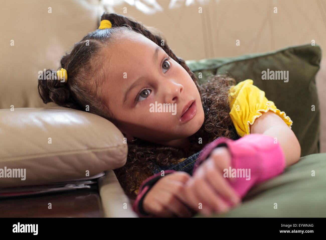 Little girl with Cerebral Palsy sitting at home Stock Photo