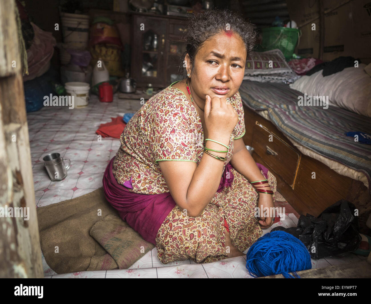 Bhaktapur, Central Region, Nepal. 2nd Aug, 2015. A woman sits in her temporary shelter in Bhaktapur. The Nepal Earthquake on April 25, 2015, (also known as the Gorkha earthquake) killed more than 9,000 people and injured more than 23,000. It had a magnitude of 7.8.  It was the worst natural disaster to strike Nepal since the 1934 Nepal''“Bihar earthquake. The earthquake triggered an avalanche on Mount Everest, killing at least 19. © ZUMA Press, Inc./Alamy Live News Stock Photo
