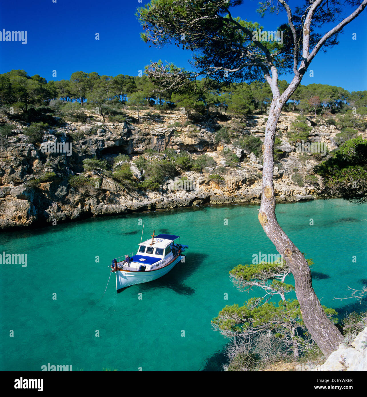 Boat anchored in rocky inlet, Cala Pi, Mallorca, Balearic Islands, Spain, Mediterranean, Europe Stock Photo