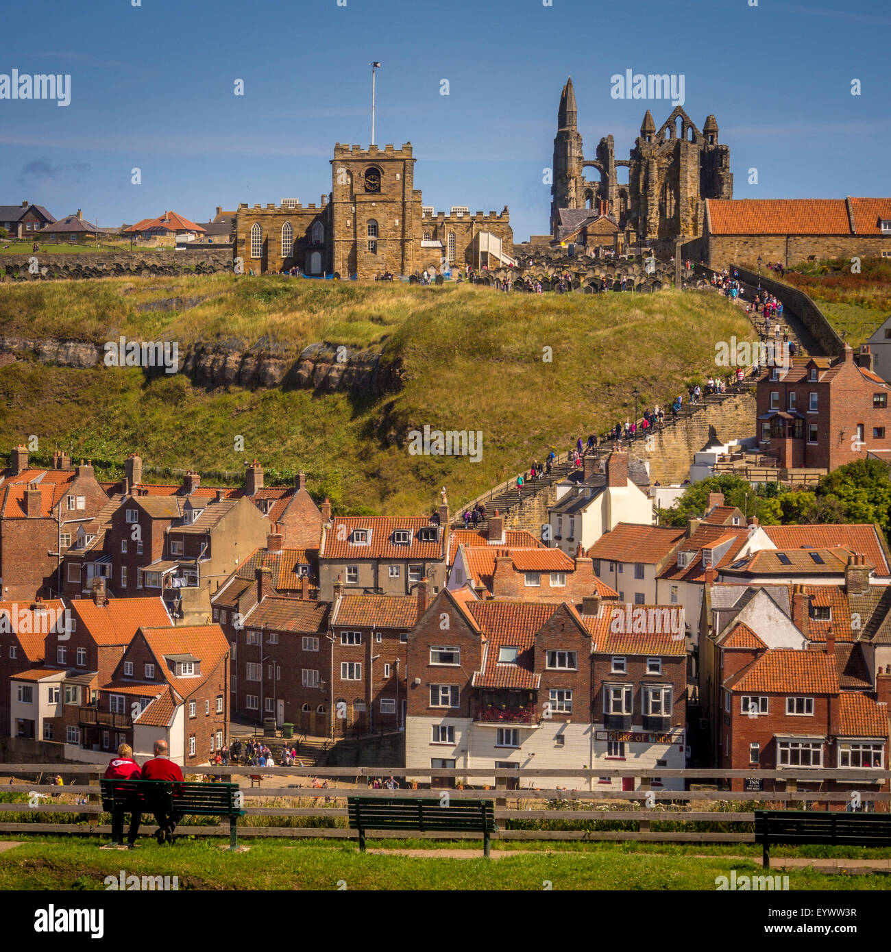 St Mary's Church and Whitby Abbey with riverside buildings in the foreground. Whitby, North Yorkshire. Stock Photo