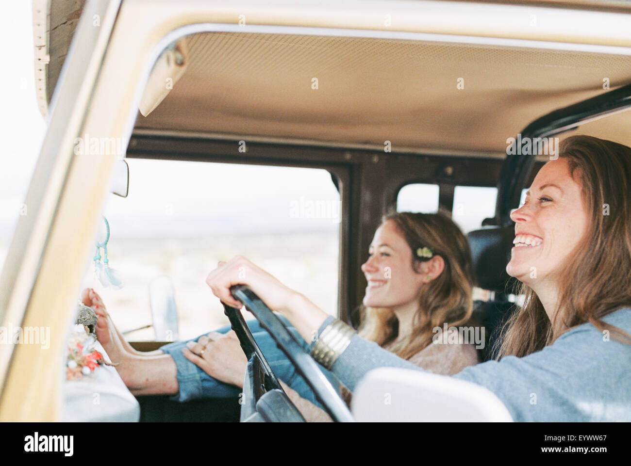 Two women on an outing in the desert, in a 4x4. Stock Photo